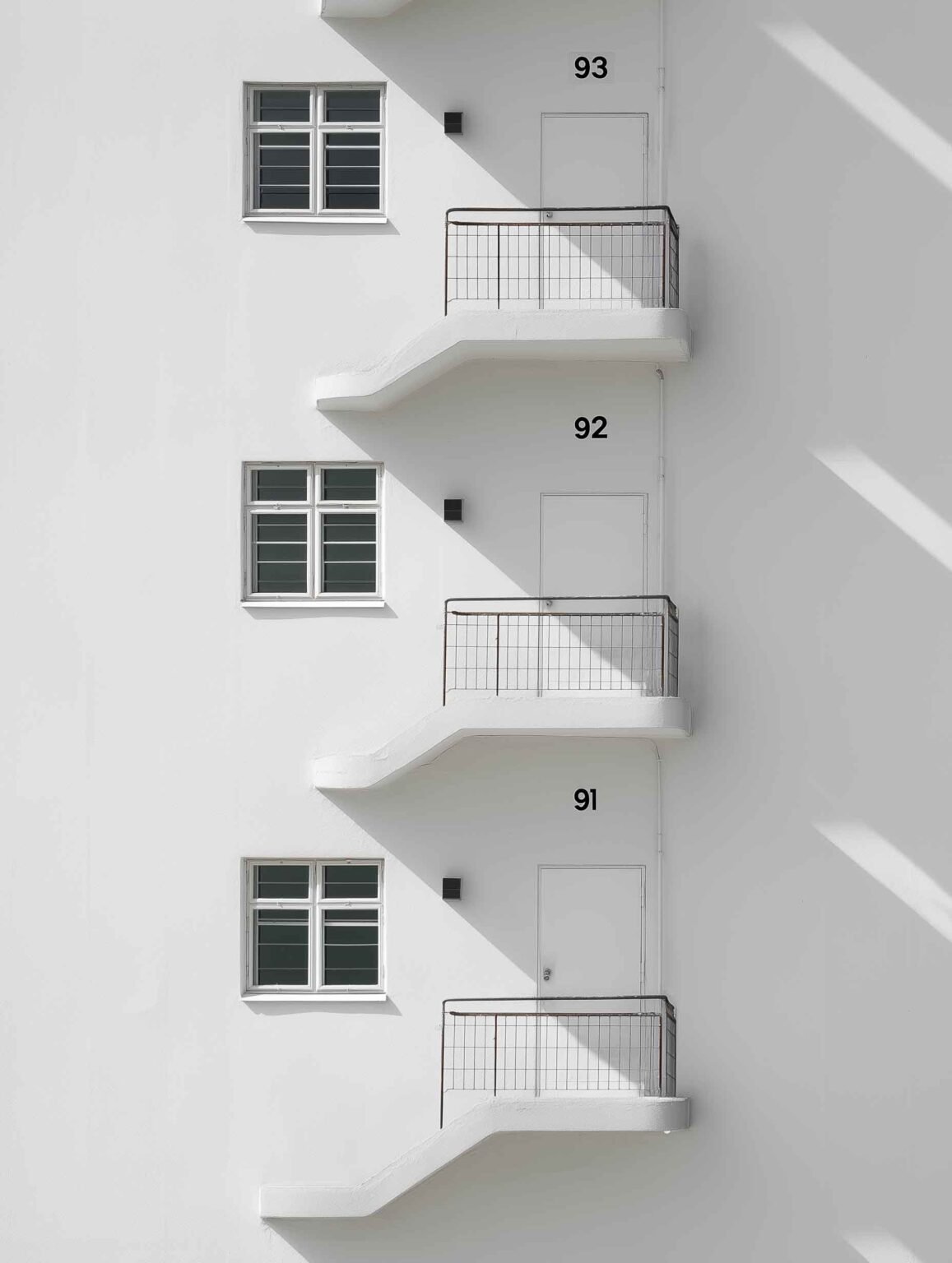 Sleek, white apartment building