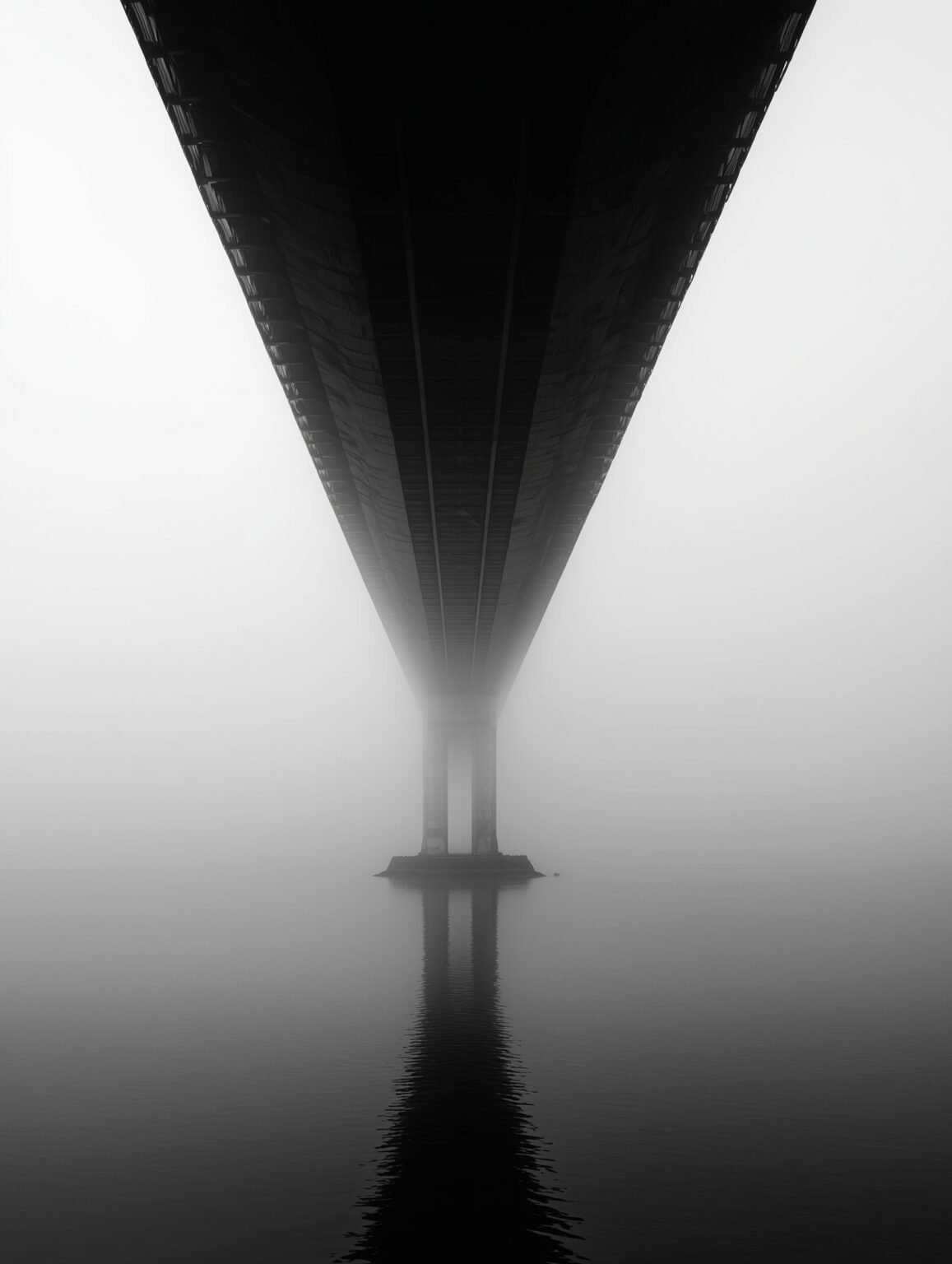 Monochrome bridge in fog