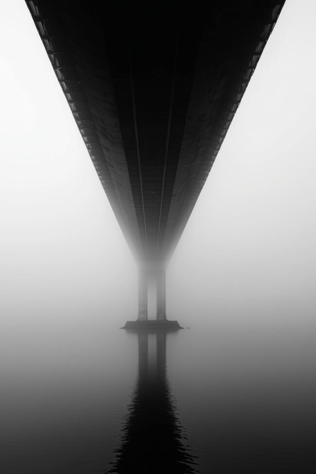 Monochrome bridge in fog