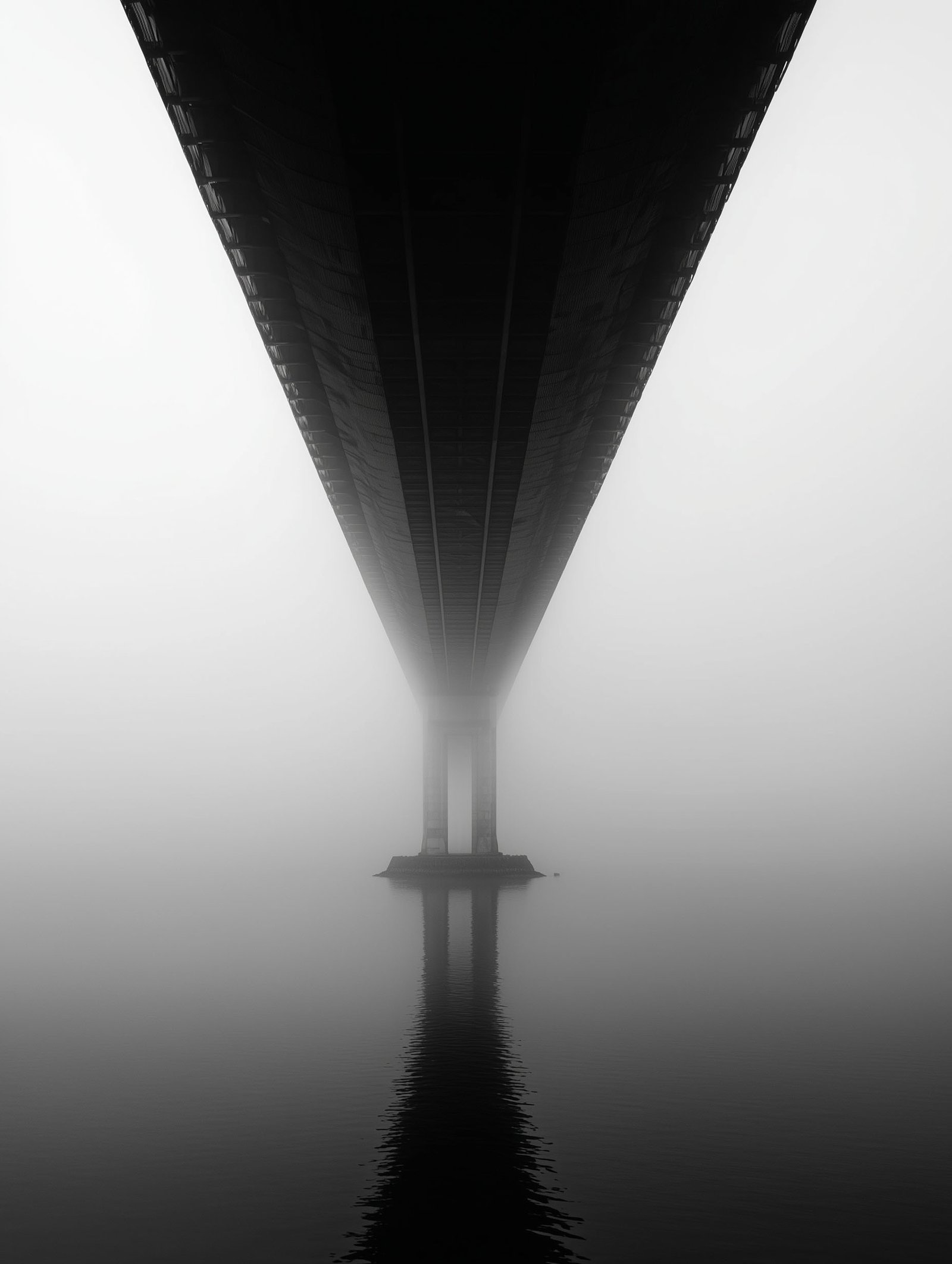 Monochrome bridge in fog