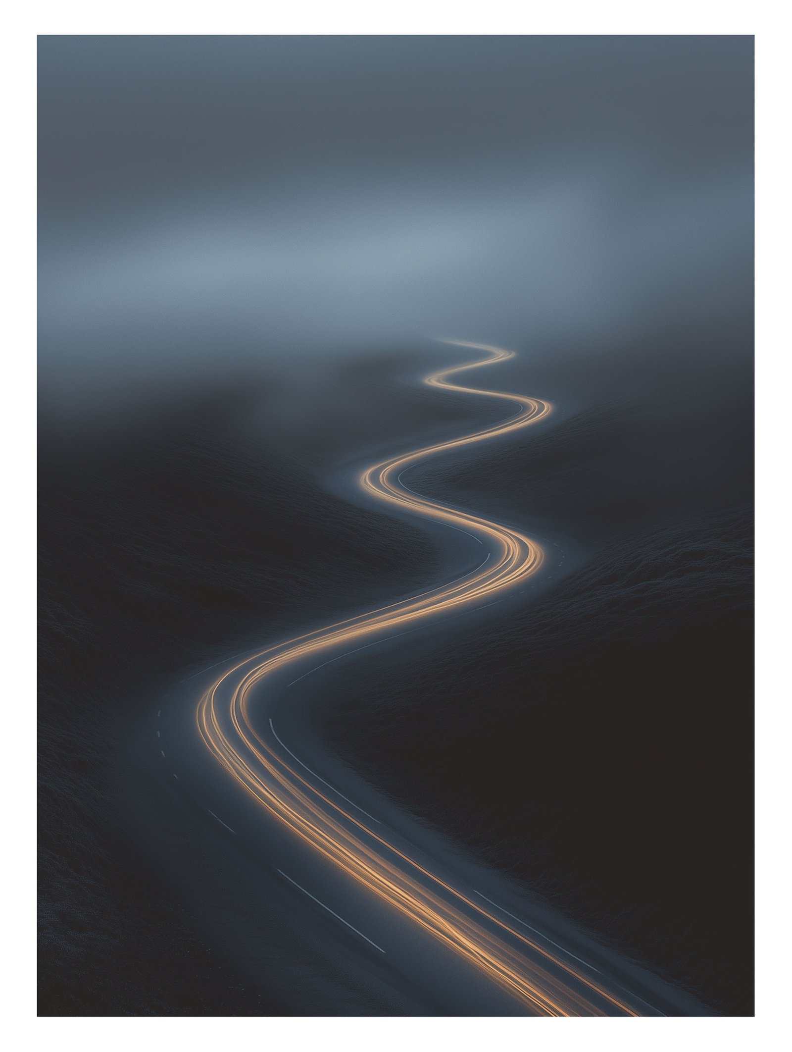 Glowing path cutting through misty hills