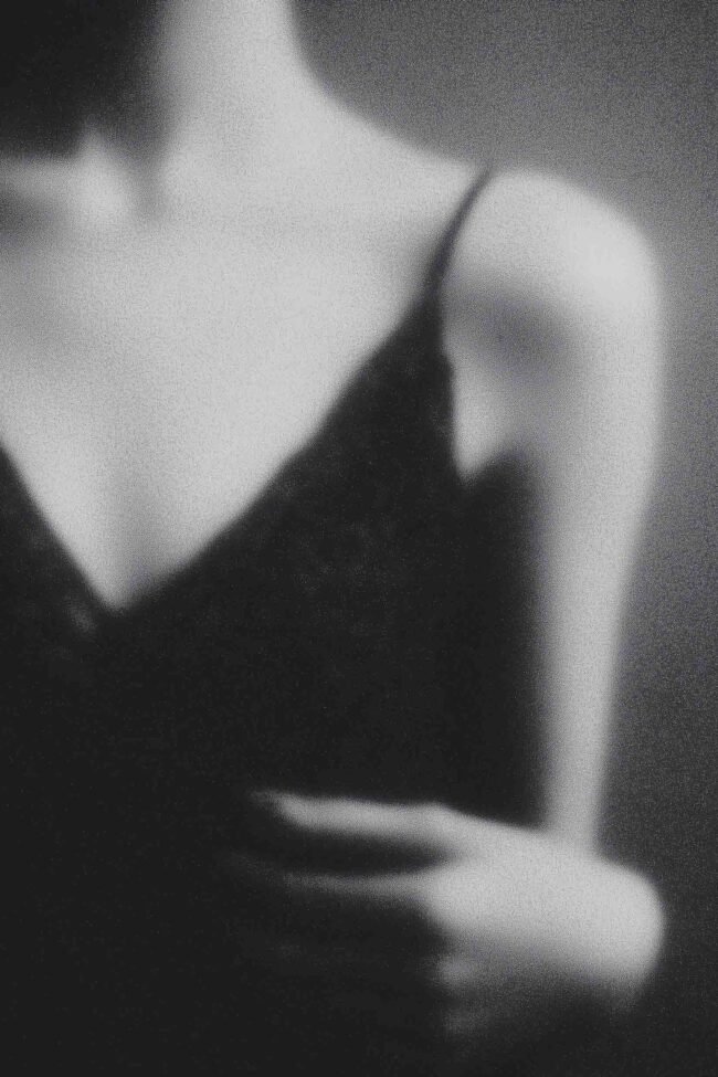 Blurred feminine silhouette in black and white