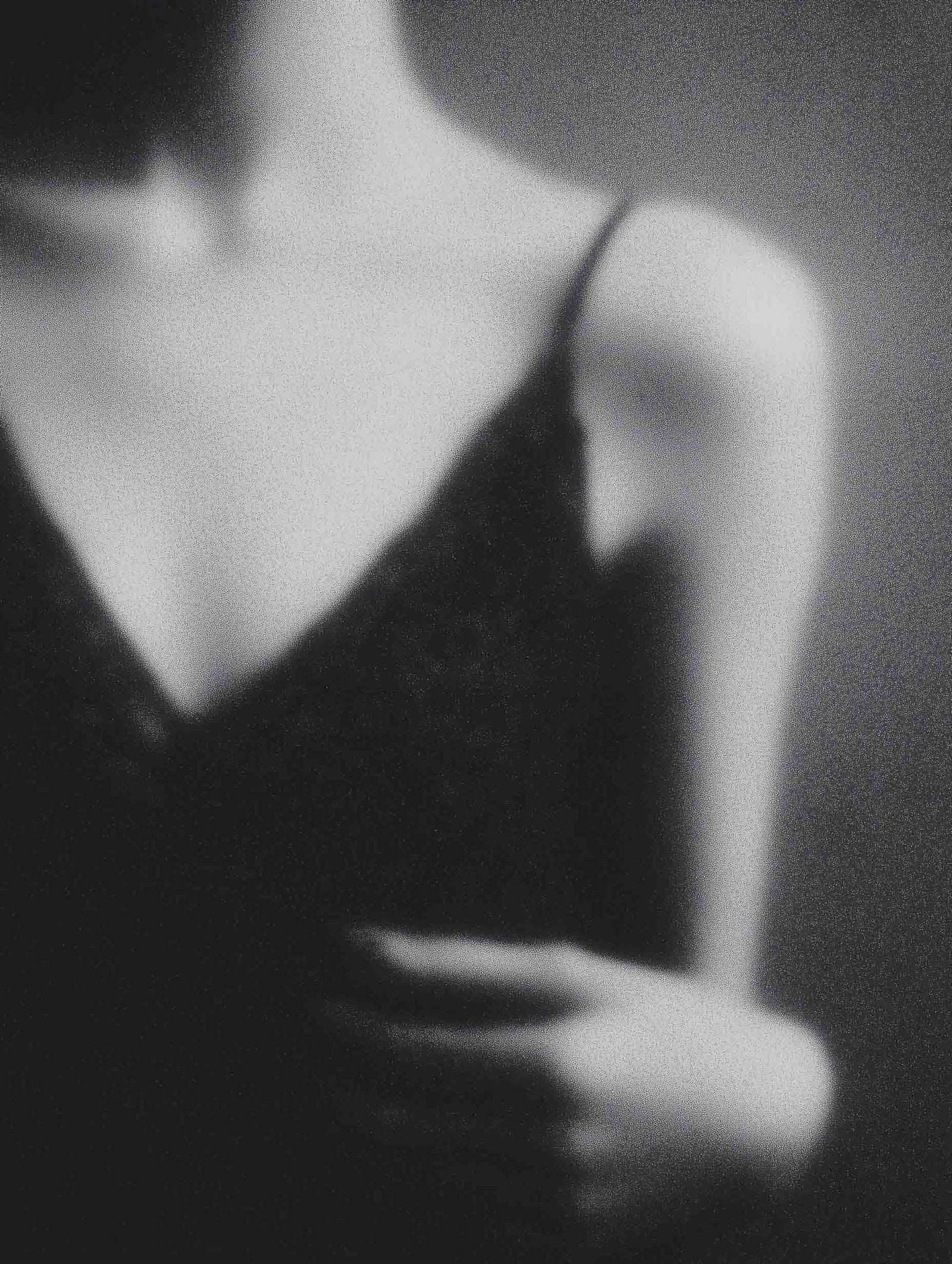 Blurred feminine silhouette in black and white