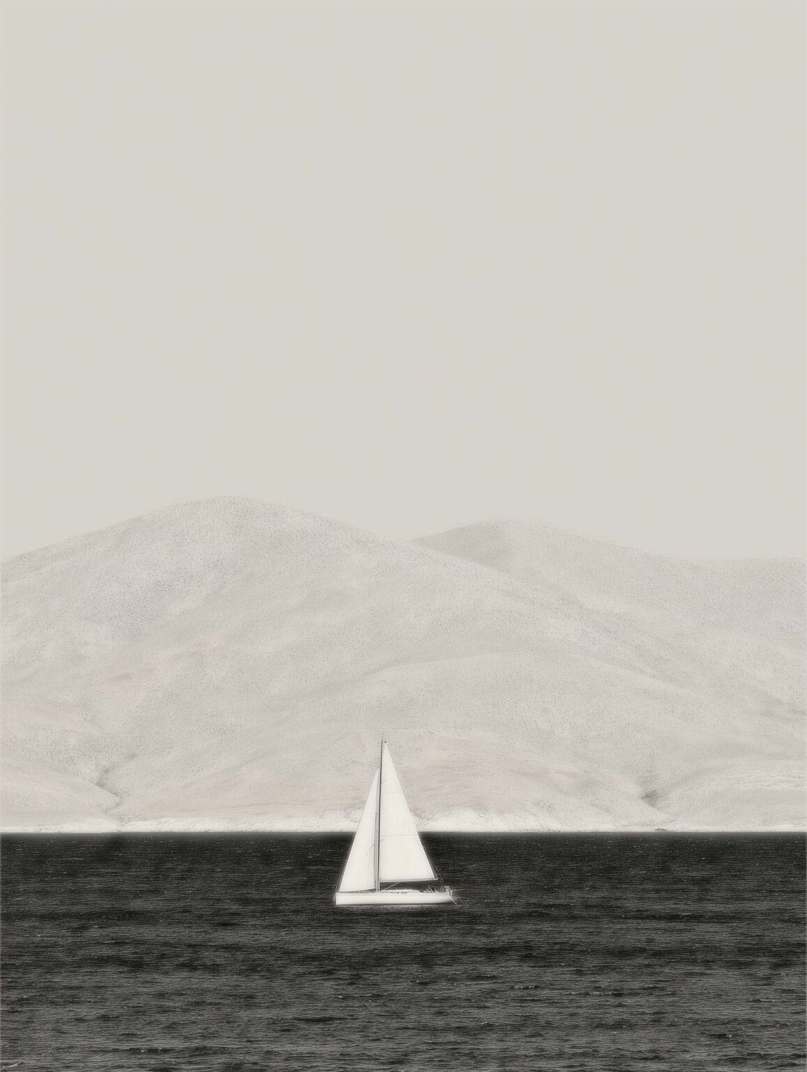 black and white seascape with a sailboat