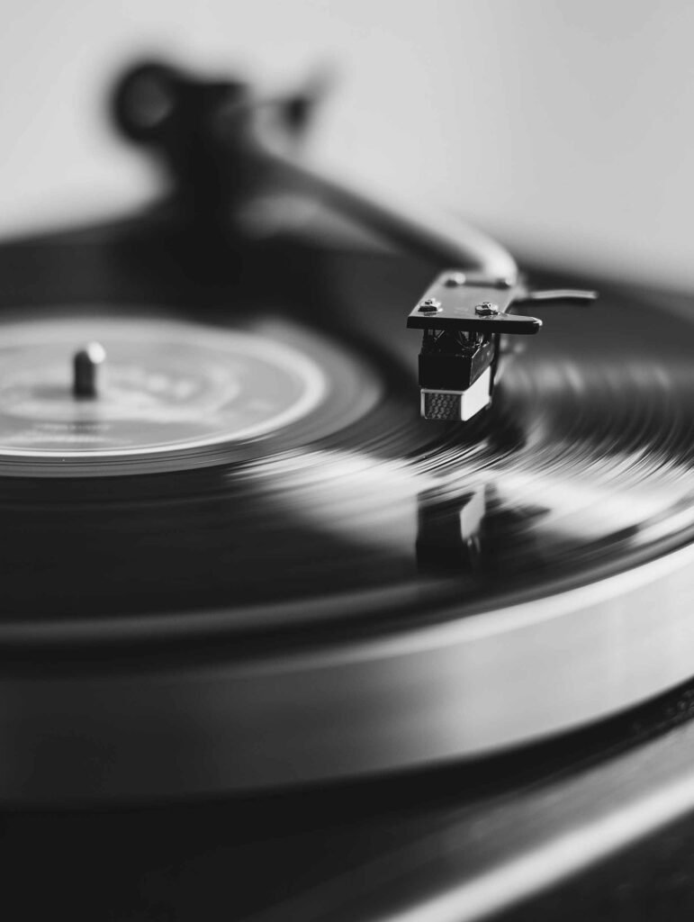 poster of a vinyl record on a turntable